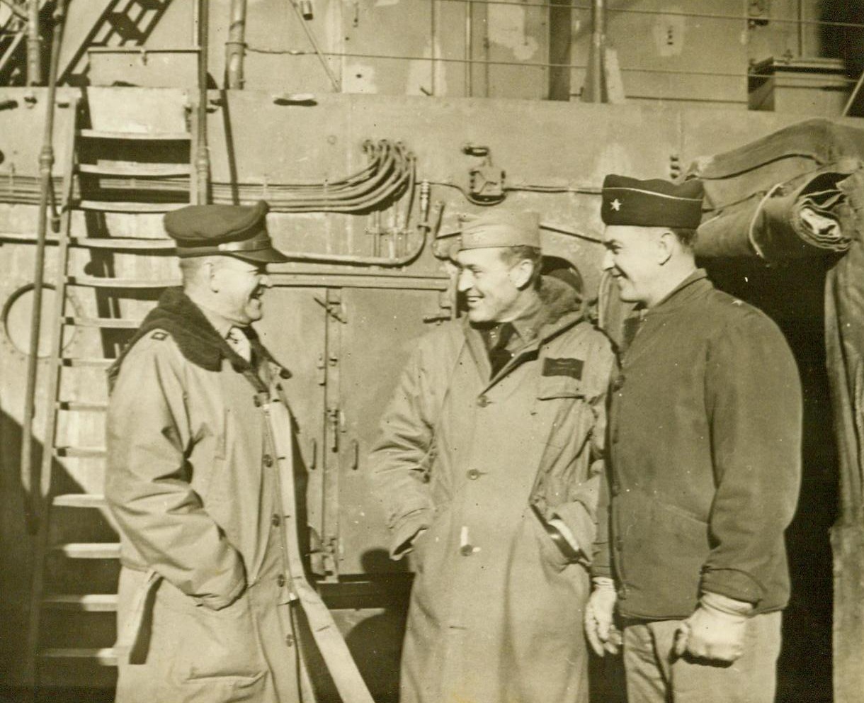 Task Force Commander and Observers, 3/2/1944. Somewhere in the Pacific— Aboard the flagship of a U.S. Naval task force which bombarded Paramushiro, Nipponese Kurile Islands Naval Base, early last February, are (LtR): Maj. Gen. Davenport Johnson, Commander with USAAF, based in Alaska; Rear Adm. Wilder D. Baker, Task Force Commander; And Brig. Gen. E. D. Post, Chief of Staff, Army Alaska Department. The two Army officers accompanied the force as observers. 3/2/44 (ACME);