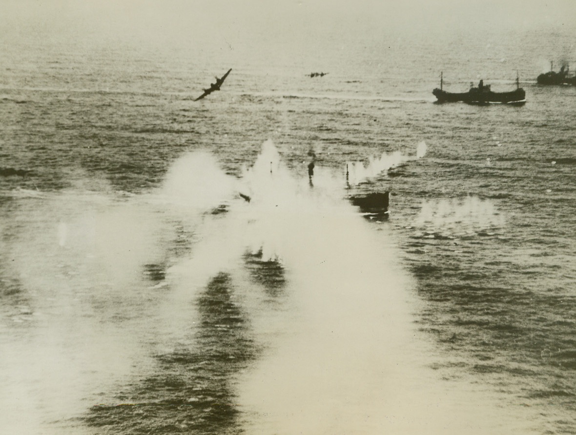 Beaufighters at Work, 4/10/1944. Smoke can be seen rising from a German 3,000-ton merchant ship after being raked by Beaufighter cannon fire. The ship was part of a large German convoy attacked by a Beaufighter strike wing of RAF Coastal Command off Friesian Islands, March 29. Two ships were hit by torpedoes and at least three others were damaged.Credit Line (Acme);