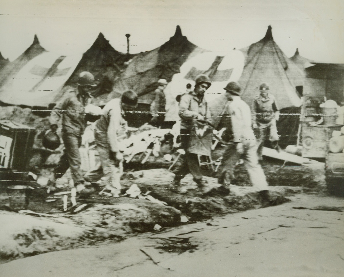 Anzio Hospital Bombed, 4/3/1944. Italy – Allied soldiers clean up the debris after the Germans bombed the U.S. Evacuation hospital at Anzio. The bombing resulted in killing two and wounding 56 at the beachhead. Credit (U.S. Army Radiotelephoto from Acme);