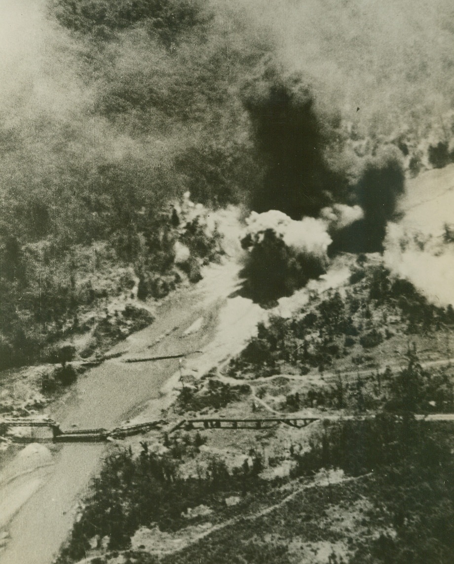 Air Commandos Strike Again, 4/24/1944. Burma – Planes of the First Air Commando Group, unique U.S. Army Air Forces organization which recently constructed air bases behind Jap lines, hit their “weekly” target, again, blasting the temporary bridge at Meza, Burma, important Nip communications artery.  At lower left in photo, can be seen the original bridge, wrecked in an earlier attack.;