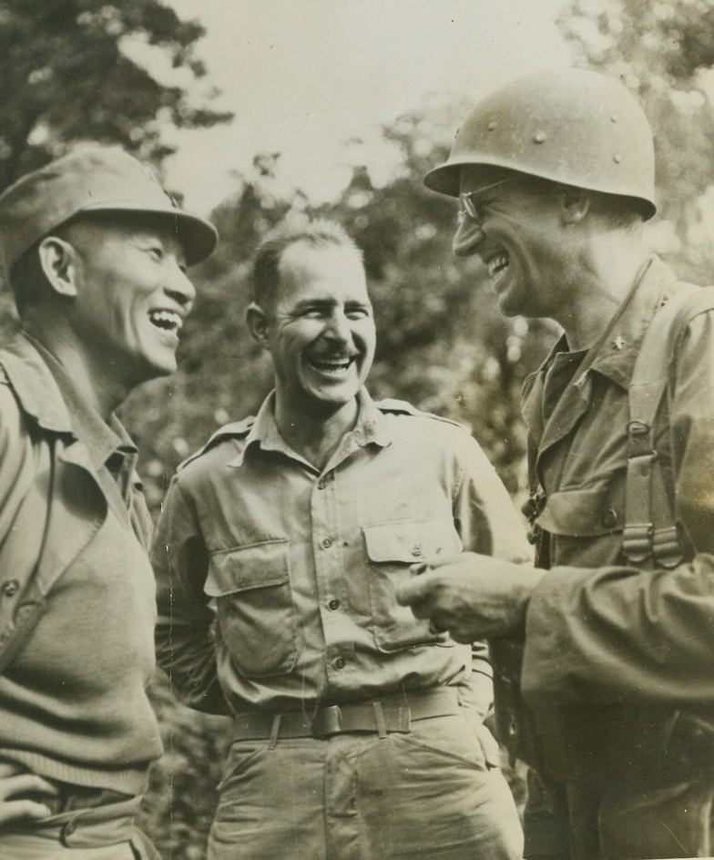 A Joke on the Japs, 4/3/1944. Burma---American Brig. Gen. Frank Merrill, (right) enjoys a joke with Lt. Gen. Sun Li-Jen (left) Chinese Divisional Commander, as they met in Burma to discuss new blows agains the common enemy.  Gen. Merrill is commander of the famous “Merrill’s Marauders”, who have been successful in driving the Japs from North Burma.  Col. Edward J. McNally (center) is laison officer serving with Gen. Sun.Credit Line (ACME);