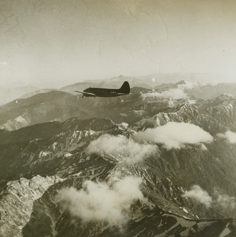 NO LANDING PLACE DOWN THERE, 4/16/1944. C.B.I. THEATRE—There’s no welcome mat for this strudy C-46 transport as it wings its way over the stern Himalayas following a hump route from India to China. Until the advent of the airplane, these high, sharp ridges successfully barred human transportation facilities. Now they are no longer a barrier, but they can still make a hump pilot’s life very tough.Credit: ACME.;