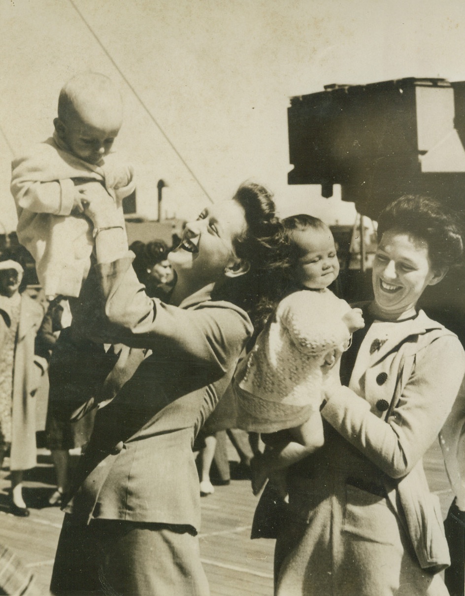 Aussie Wives Head for U.S., 4/19/1944. AUSTRALIA – Two Australian wives of American servicemen pose with their babies aboard a ship leaving an Australian port for the United States. Marriage to U.S. servicemen does not bestow citizenship on the gals. Credit: ACME;