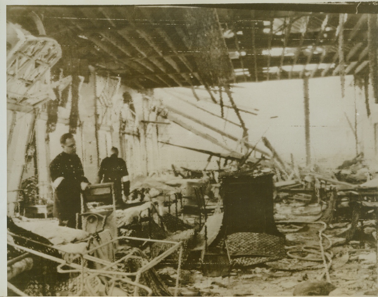 London Hospital Hit in Nazi Raid, 4/19/1944. LONDON -- This dramatic photo shows what was left of one of the wards in a London hospital after a direct hit during a Nazi raid on the capital. The hospital, one of London's largest, housed 2,000 patients. Nurses worked frantically but effectively in evacuating most of the patients. Rescue workers, however, are still digging in the wreckage in a search for casualties. Credit: (ACME Radiopohoto);