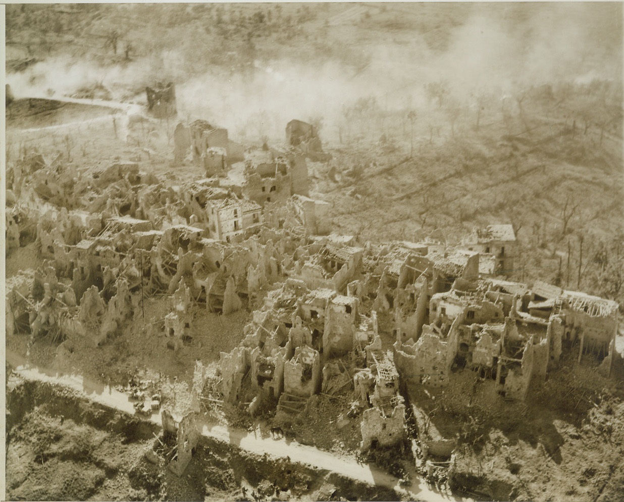 Scars of Battle, 5/25/1944. Italy – Home gutted by shellfire, the Italian town of Santa Maria Infante shows its battle scars – shell-shattered and bomb wracked. This was the first Italian town of any consequence taken by the American troops of the Fifth Army in the current offensive. Credit-WP-(ACME Photo by Charles Seawood, War Pool Correspondent);