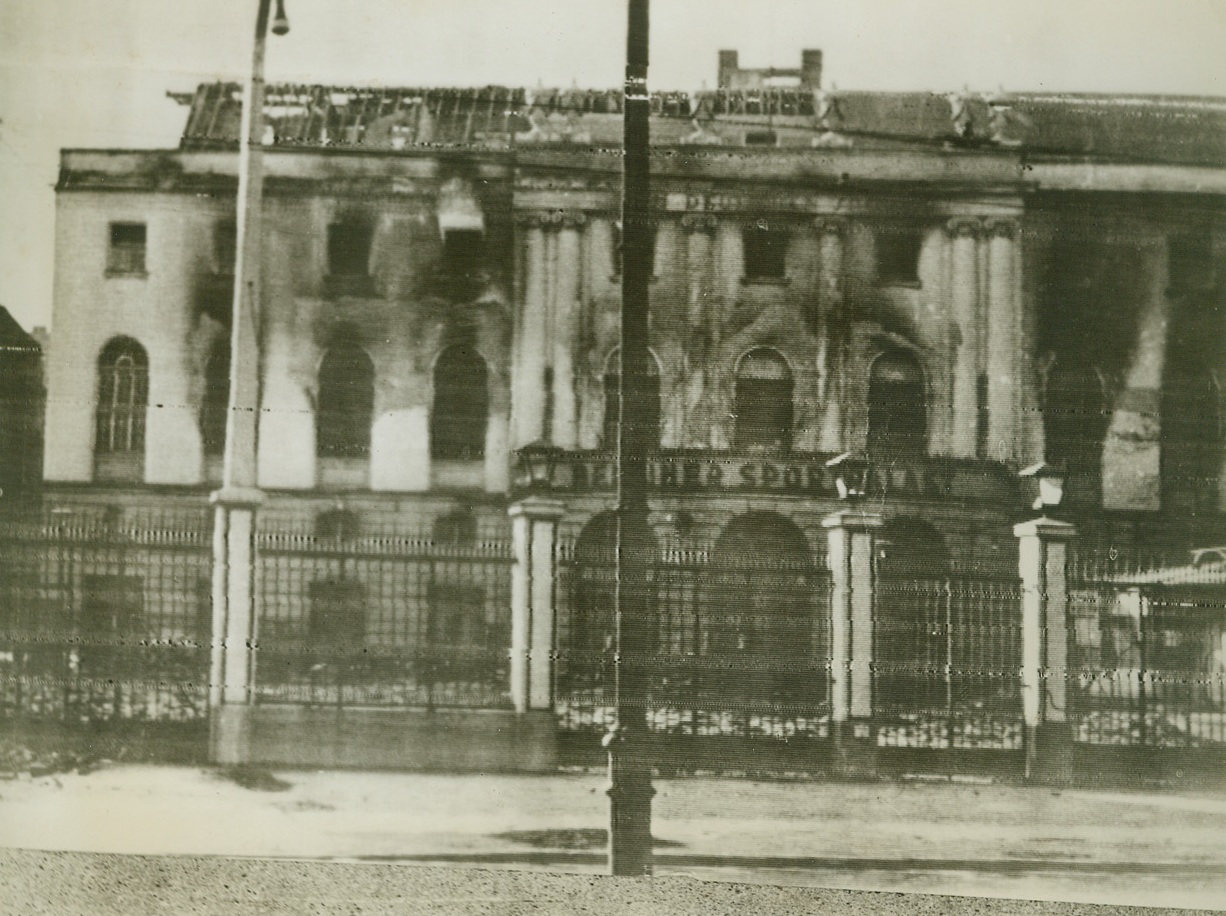 NO MORE HEIL-ING HERE, 5/19/1944. BERLIN, GERMANY—This photo, received by radio from a neutral source, shows the Berlin Sportpalast, home of the famous “Heil, Hitler” speeches, merely a shell left standing after a recent Allied attack on the German capital. It was in this stadium that the youth of Germany gathered to pay blind homage to their Paperhanger Dictator.Credit: Acme;