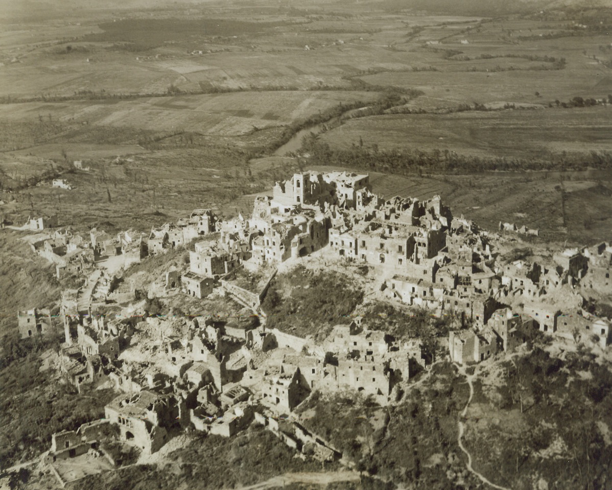 Marked by Allied Artillery, 5/25/1944. ITALY—The cluster of homes that was San Ambrogia remains just a shattered bomb-gutted town after a heavy barrage by Allied guns and planes. The town was taken by American troops of the Fifth Army as it continued its progress along the road to Rome. Credit: ACME Photo by Charles Seawood, War Pool Correspondent.;