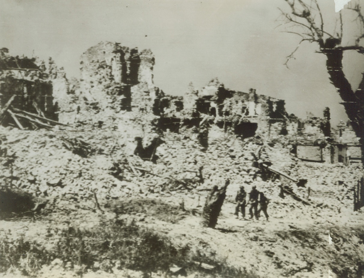 RUBBLED ADVANCE, 5/17/1944. ITALY—A trio of Americans walk through the debris-filled streets of San Maria Infante which was captured by the Allies after they renewed their offensive actions against the German forces in Italy.Credit: U.S. Army Radio from Acme;