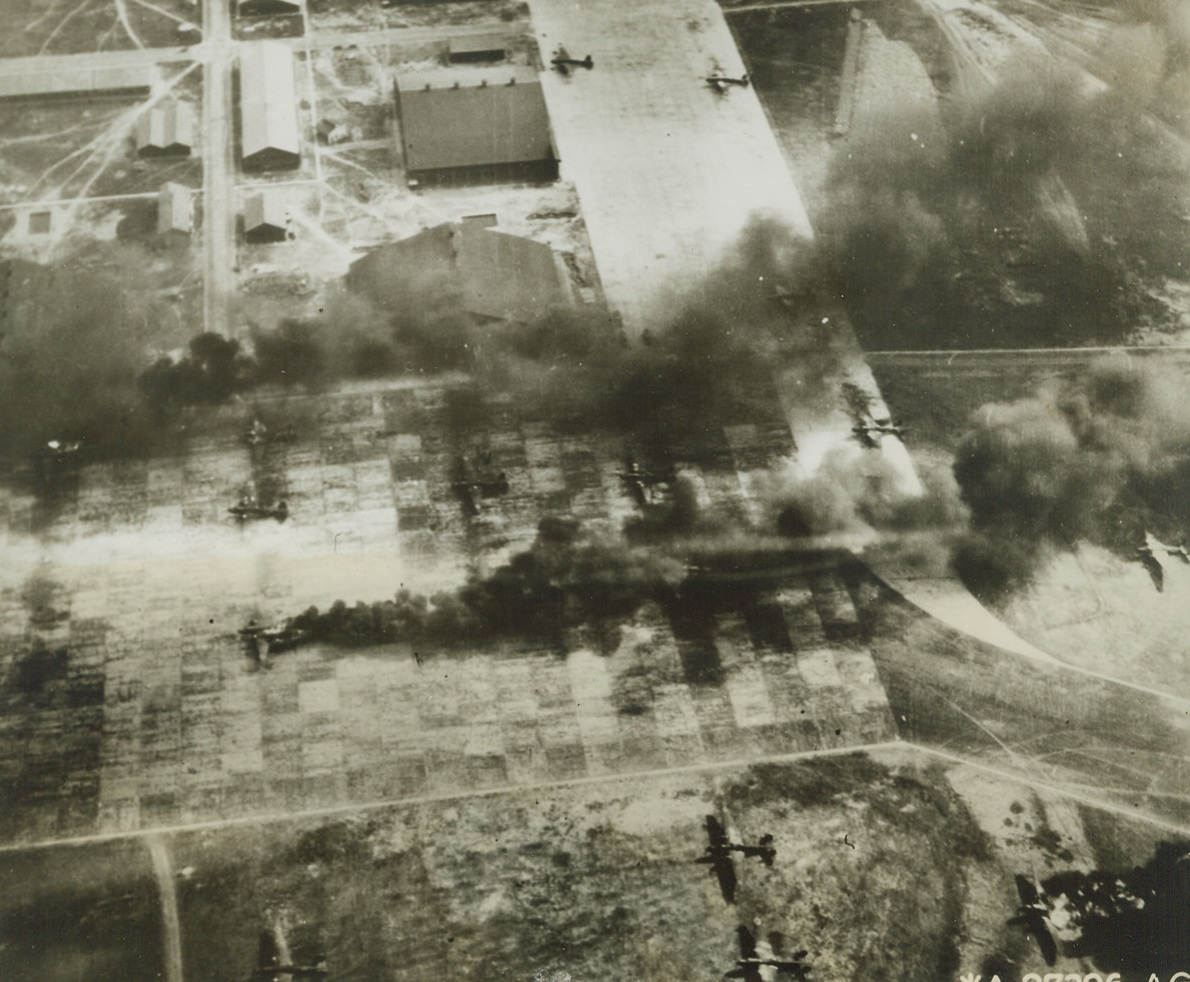 Jap Airbirds Grounded for Good, 5/5/1944. Formosa – These Jap planes are all lined up for a possible hurried flight call, but it will be a long time (if ever) before they will ever take to the air again. Strafing USAAF planes raiding Shinkchiku Airdrome found these grounded “Nells” easy prey for their bullets and fragmentation bombs, and they’re knocking them off one by one with the Japs powerless to stop the raiders. This photo was taken from a B-25. Credit: Official AAF photo from ACME;