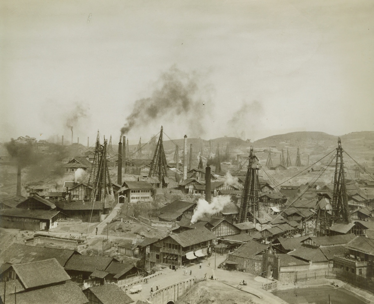 Salt for the Cellars of China, 5/23/1944. Tse Liu Ching, China – One of the most thriving industries in this area of China is the salt mines located at Tse Liu Ching. These mines, 2,600 years old, are cultivated by rustic methods, but nevertheless produce 250,000 metric tons of salt a year, or one fourth of all the salt produced in free China. Three hundred thousand laborers work the mines, from which salt is shipped to all parts of the East. Picture shows: A general view of a salt well city. The wells are from three to four thousand feet deep and take 4 years to dig. Credit: ACME photo by Frank Cancellare, War Pool Correspondent;