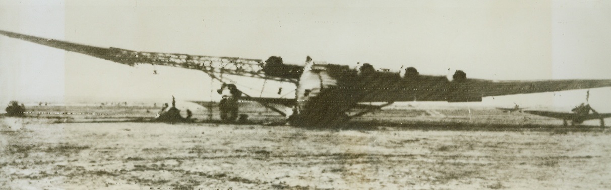Wrecked by Red Plane, 5/25/1944. On the Ukranian Front – This enemy warbird, a “Messerschmitt-323-Giant”, was wrecked by a Soviet plane on the Third Ukranian Front. No large-scale action is being reported on the German-Soviet front at present, but patrol and reconnaissance outfits continue activities against the Nazis. A late communiqué announces that the Russians have destroyed 27 German tanks and self-propelled guns as well as nine enemy planes during these actions. Credit: ACME Radiophoto;