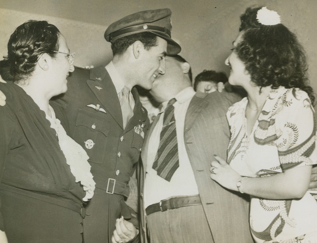 Put It There, Dad, 5/22/1944. Piqua, O. - Patsy Gentile, father of the famed American Ace Don Gentile who downed 23 Nazi planes in combat and shot seven on the ground, gave his son a warm welcome as he returned home on furlough. Mrs. Gentile and Don’s sister Edith made the reunion complete in Piqua, O. Credit: ACME;