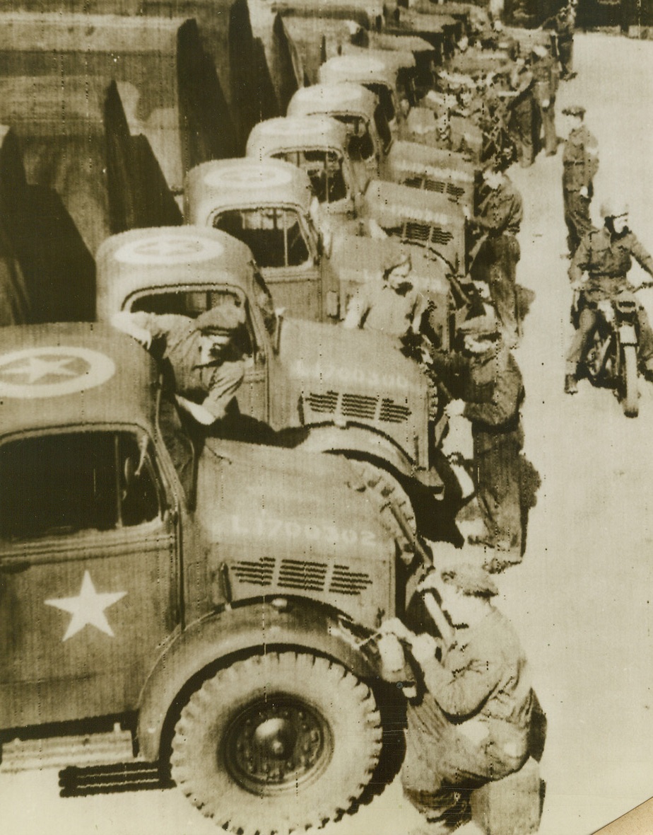 U.S. STAR MARKS ALLIED INVASION VEHICLES, 5/31/1944. ENGLAND – The five pointed white star which, until recently, marked trucks, tanks and other vehicles of the U.S. forces, will mark all vehicles of the Allied Expeditionary Force for the forthcoming invasion.  An example ofh the complete integration of men and equipment under the command of Gen. Dwight D. Eisenhower, the “invasion star” here, (above), is shown being painted on British Army vehicles “somewhere in England.”  This photo was radioed from London to New York tonight.Credit: Acme radio photo;