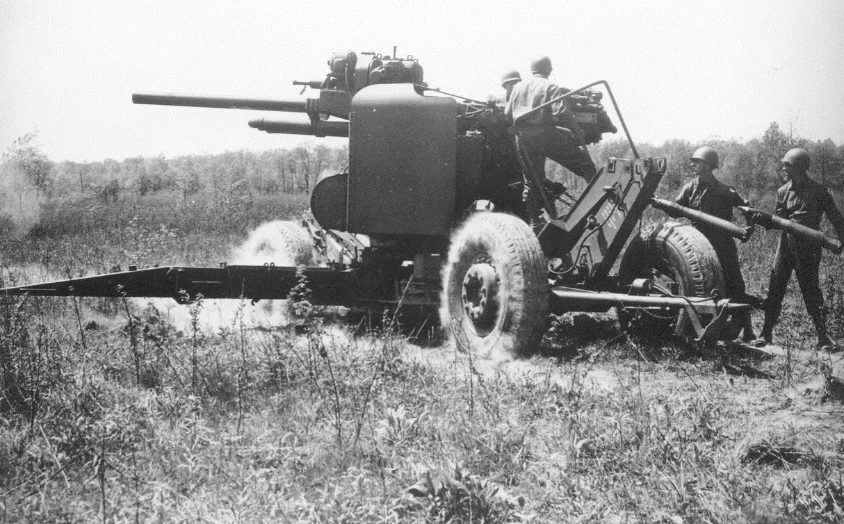 Versatile Artillery, 5/19/1944. The 90-MM. Anti-Aircraft Gun, developed by the Ordinance Department, has become one of the most versatile weapons in the service. Besides being used against aircraft, the weapon has been found to be extremely effective as an anti-tank gun. For this purpose it is fired from its mobile carriage. The gun will be on exhibit in Washington, D.C., during The Weapons of War Exhibit. 5/19/44 (ACME);
