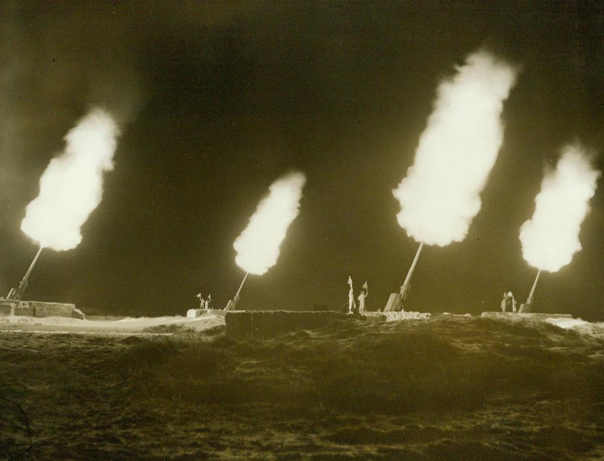 Martian Pattern Paints Luftwaffe Doom, 5/29/1944. Camp Davis, N.C. – A battery of 120MM. anti-aircraft guns, firing simultaneously during night practice at Camp Davis, N.C., create weird patters of light – Designs for the destruction of Hitler’s Luftwaffe. The gun has a vertical range higher than any other anti-aircraft gun known in use. It has been dubbed the “Stratosphere” gun as shells fired actually do go that high. 5/29/44 (ACME);