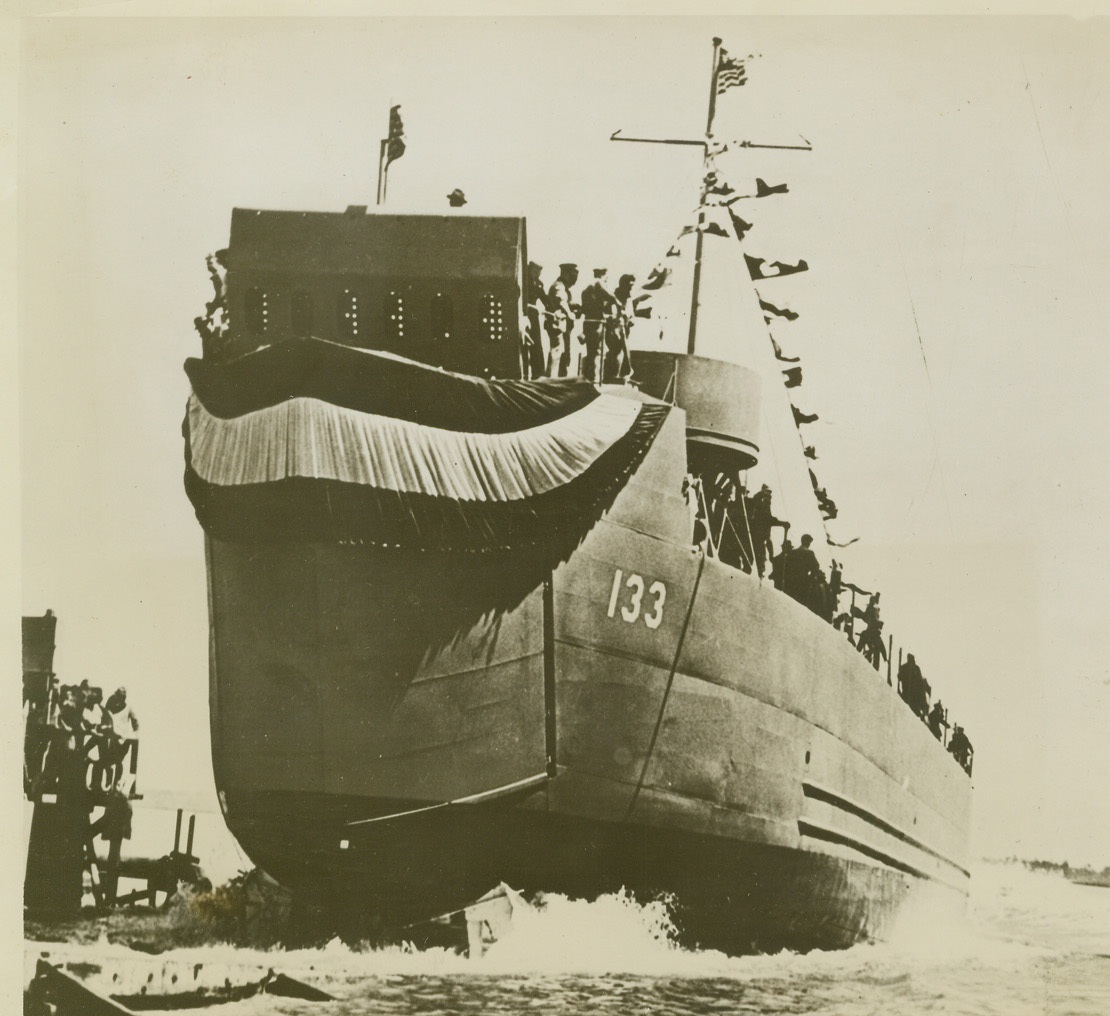 Newest Navy Craft, 5/8/1944. CHARLESTON, S.C. -- With bunting flying from its bow, one of the U.S. Navy's newest amphibious craft, the LSM (Landing Ship, Medium) is launched at Charleston, S.C. Smaller than the LST (Landing Ship, Tank) and larger than an LCT (Landing Craft, Tank) the LSM is an ocean-going vessel, with a bow that opens lowering a ramp down which men, machines and materials roll onto enemy beaches.  Credit (Official Navy Photo from ACME);