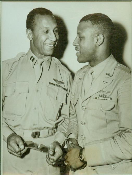 Air Heroes Hold Press Interview, 6/24/1944. NEW YORK - Home on leave after flying with the 99th Fighter Squadron, famed all-negro flying group, Capts Charles R. Hall (right) of Brazil, Ind., and Lemuel R. Custis, Hartford, Conn., are devoting their furloughs to the sale of war bonds. Both pilots have flown in the Mediterranean Theater, and Capt. Hall has been awarded the Distinguished Flying Cross. Through the two flyers, the National Association for the Advancement of Colored People has purchased $40,000 in war bonds during the fifth war loan drive.;