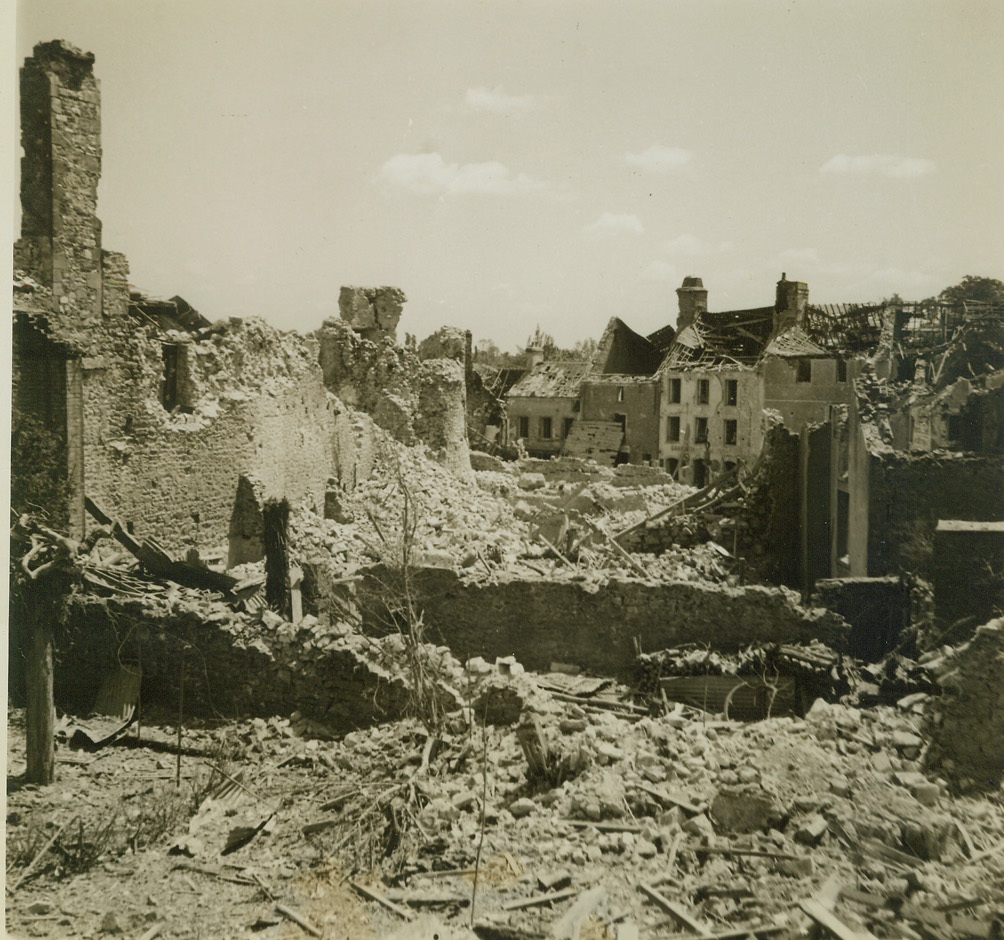 Once a City, 6/23/1944. St. Sauveur, France – All that remains of St. Sauveur is a mass of rubble and fragments of buildings left standing after the Germans fled from the town. Civilians who evacuated their homes returned to find only a wall or two left, and often members of their families lay dead in the ruins. Credit (ACME Photo by Andrew Lopez, War Pool Correspondent);