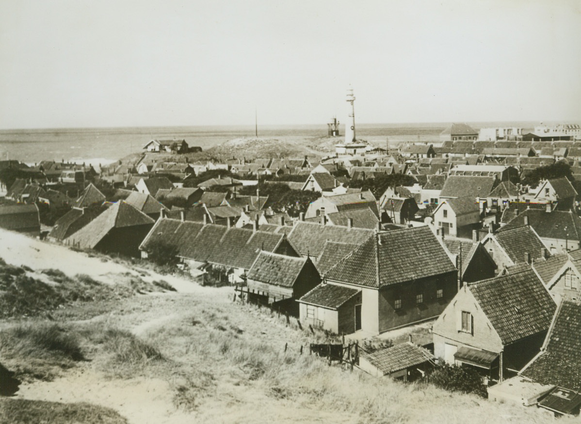 DUTCH ADVISED TO LEAVE, 6/5/1944. Shortly after the German Radio Reported that invasion operations on the French Coast had begun, BBC carried an urgent message to the people of Holland from the Allied High Command. All people living within 18 miles of the Dutch Coast were advised to leave their homes—Homes such as those shown in photo—immediately, and to keep off roads, railways and bridges. This is a scene at Egmond Aan Zee on the north seacoast of Holland, with the North Sea on the horizon in background.  Credit: ACME PHOTO FROM NETHERLANDS INFORMATION BUREAU;