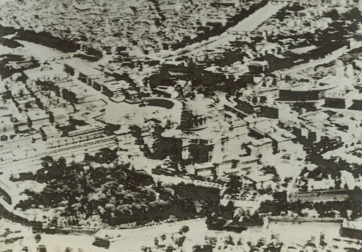 Rome - As Allies  Reached Its Gates, 6/4/1944. ROME-Allied Fifth Army troops were hammering at the gates of Rome as this photo was made from a B-26 medium bomber by ACME photographer Charles Seawood for the War Picture pool. Vatican City lies in center of photo, with the familiar dome of St. Peter’s Cathedral clearly shown. The Tiber River, spanned by numerous bridges, winds in background.  Credit: ACME photo by Charles Seawood, transmitted via U.S. SIGNAL CORPS RADIOTELEPHOTO.;