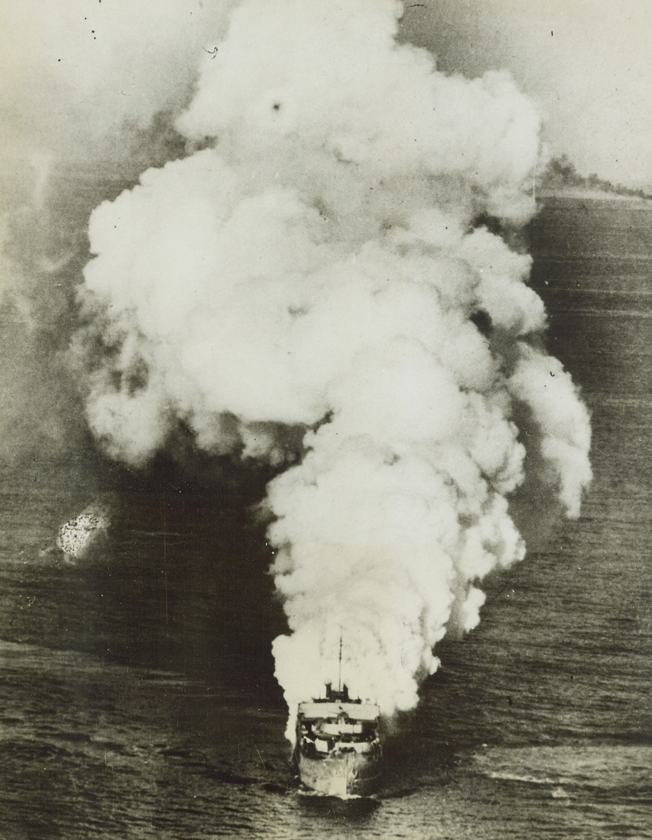 A Kill for Rocket Beaufighters, 6/27/1944. An armed merchantman, part of a large German convoy in the Aegean Sea, burns furiously from stem to stern after being blasted by rocket-carrying Beaufighters of the RAF, recently. This new RAF weapon has been used very effectively against enemy shipping and this is one of the first photos of its use against German surface craft. Credit: BRITISH OFFICIAL PHOTO FROM ACME.;