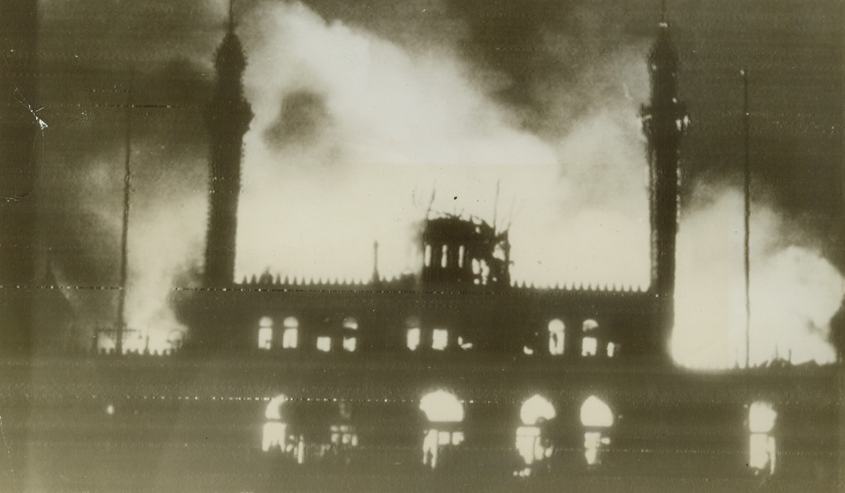 Work of Nazi Arsonists, 6/30/1944. COPENHAGEN, DENMARK—Flames lick at the buildings of the world-renowned Tivoli Amusement Park in Copenhagen, which was set afire by the Nazi Schalburg Corps on Friday night (June 23rd). The concert house is in foreground. This EXCLUSIVE ACME photo, obtained through the Free Danish Press Service, was radioed to New York, June 30th, 1944. Credit: ACME RADIOPHOTO.;