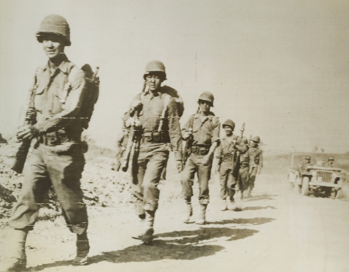 Americans All, 6/1/1944. ITALY—Japanese-American infantrymen of a Fifth Army Division move up to the front to tackle another town on the road to Rome. These Japanese, Americans all, have played a notable role in the spectacular offensive in Italy. Credit: U.S. ARMY RADIOTELEPHOTO FROM ACME.;