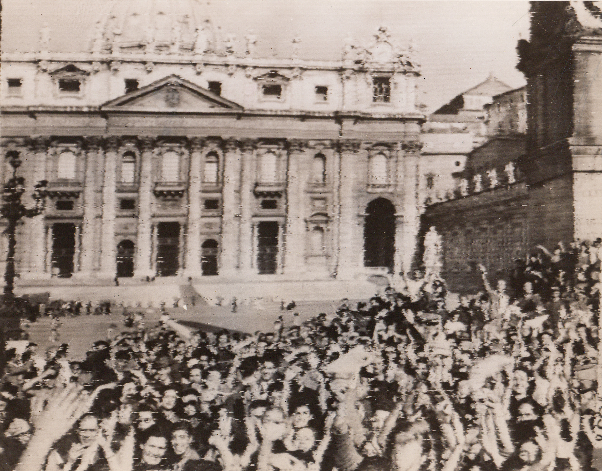 ITALIANS CHEER IN SHADOW OF CHURCH, 6/5/1944. VATICAN CITY—Jubilant Italians, gathering before historic old St. Peter’s Cathedral in Vatican City, wave and cheer wildly as Allied troops move triumphantly through the streets of Rome. Photo was made from an Army vehicle, which was completely hemmed in by joyous throngs.;