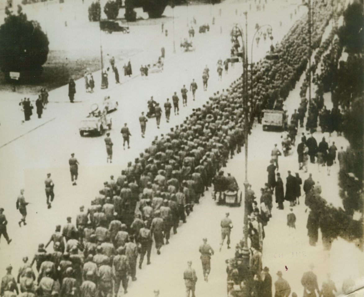 Allied Prisoners in Rome, 6/19/1944. ROME, ITALY – This group of marching men, according to the German newsreel from which the picture was taken, are Allied soldiers, captured in the fighting in Italy, being marched thru Rome en route to a German prison camp. These boys may still be prisoners, but the Germans no longer occupy Rome.Credit Line (Acme);