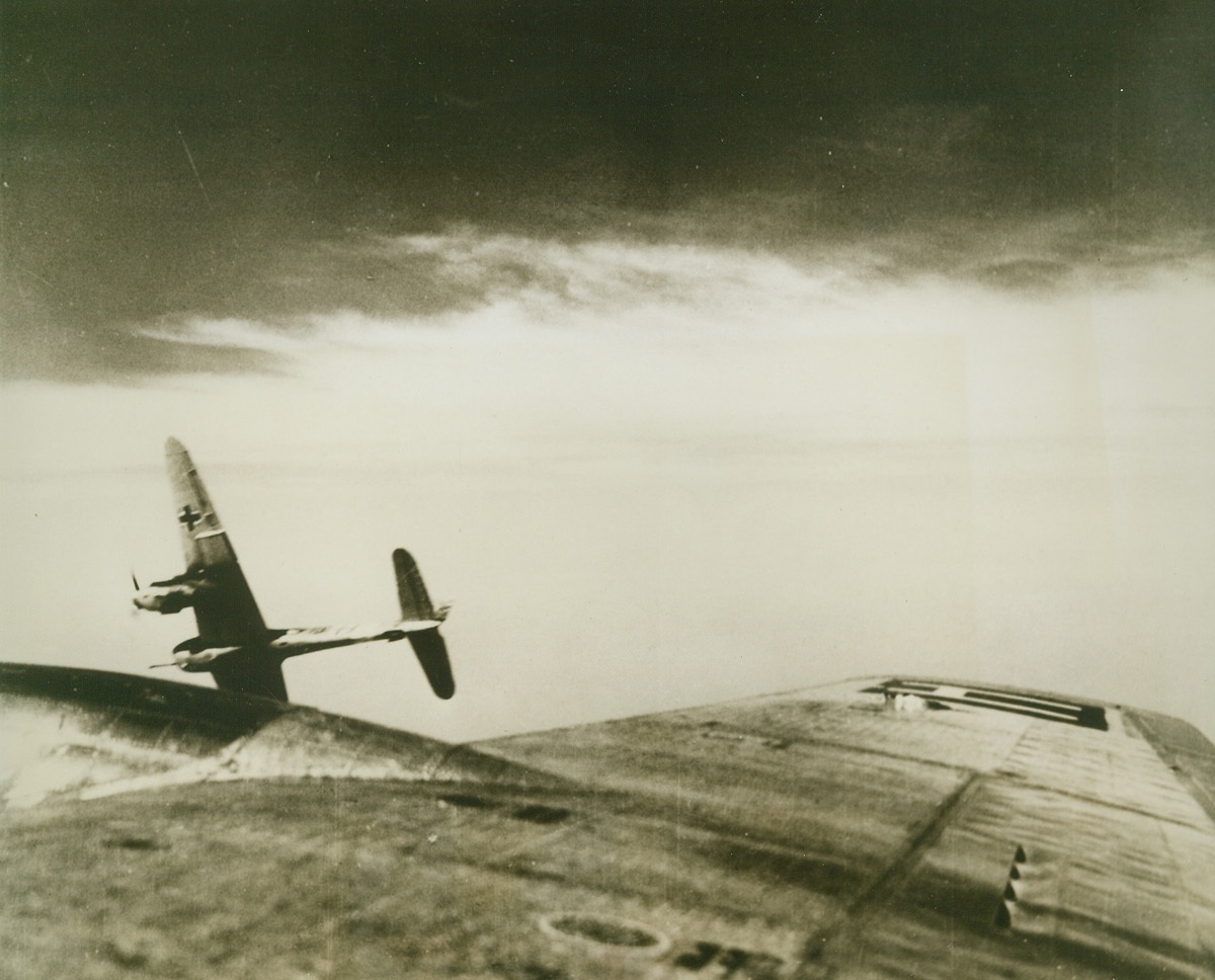 Nazi Messerschmitt Takes a Dive, 6/17/1944. Not many pictures like this one come out of the war. You are looking out of an American Flying Fortress at a Nazi Messerschmitt less than 25 feet off the bomber’s wing, just as the fighter pulls away to start its dive. The photograph was taken by Sgt. Victor LaBruno, Jersey City, N.J., while he was flying as a combat aerial photographer during a U.S. Army 8th Air Force attack on the synthetic oil plants at Brux, near the border of Czechoslovakia. As more than 100 German fighters attacked the formation of Flying Fortresses, Sgt. LaBruno crouched in the radio room of the B-17 “Lady Godiva” and caught this unusually near shot of a Nazi fighter. In civilian life, Sgt. LaBruno was a photographer in New York City.Credit (USAAF Photo from Acme);