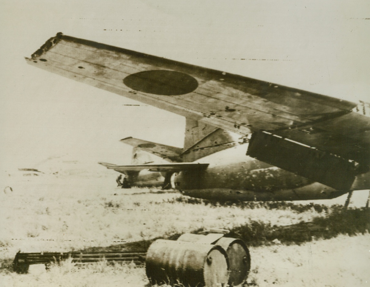 Jap Planes – Dead Ducks, 6/24/1944. Saipan – Damaged Jap warplanes lie useless on the Aslito Airstrip on Saipan, mute testimony of the work of American fliers who kept these enemy birds of war out of action. Latest reports state that American patrols have penetrated into the capital city of the Japanese Marianas meeting almost no opposition. Credit: Signal Corps Radiotelephoto from ACME;