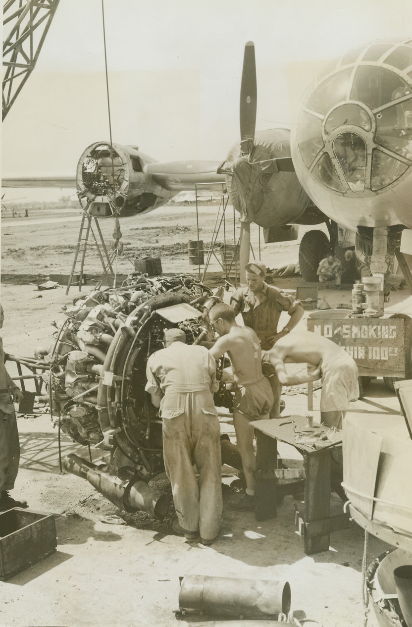 Tuning Up for the Raid on Japan, 6/17/1944. Somewhere-In-India – B-29 bombers, America’s newest air armada were tuned up at a base somewhere in India ad from there started on their mission to bomb the steel center of Japan on June 15th.  The photos were shipped from India on June 12th and were received in Washington, June 17th due to the expediting of the air transport command.  This photo shows a B-29 receiving an engine exchange. Credit line (ACME photo by Frank Cancellare for the War Picture Pool);