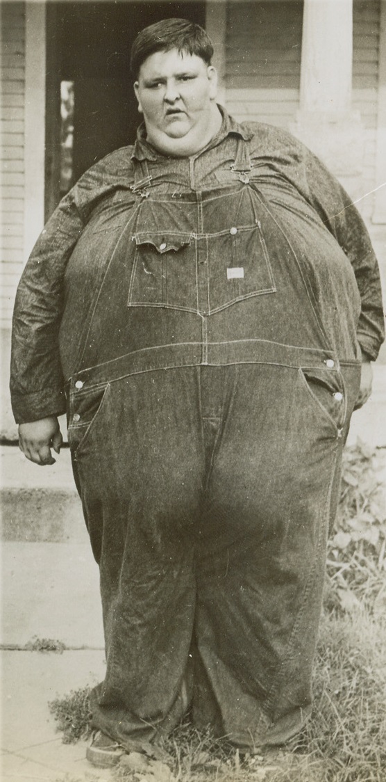 Just Call Me “Chubby”, 6/9/1944. Mt. Sterling, Ill. – Robert Hughes, 18, of Mt. Sterling, Ill., weighing 709 pounds, is the heaviest draft registrant in the country.  Officials said his excessive weight would probably keep him out of service.  He has a waistline of 95 inches. Credit line ACME;