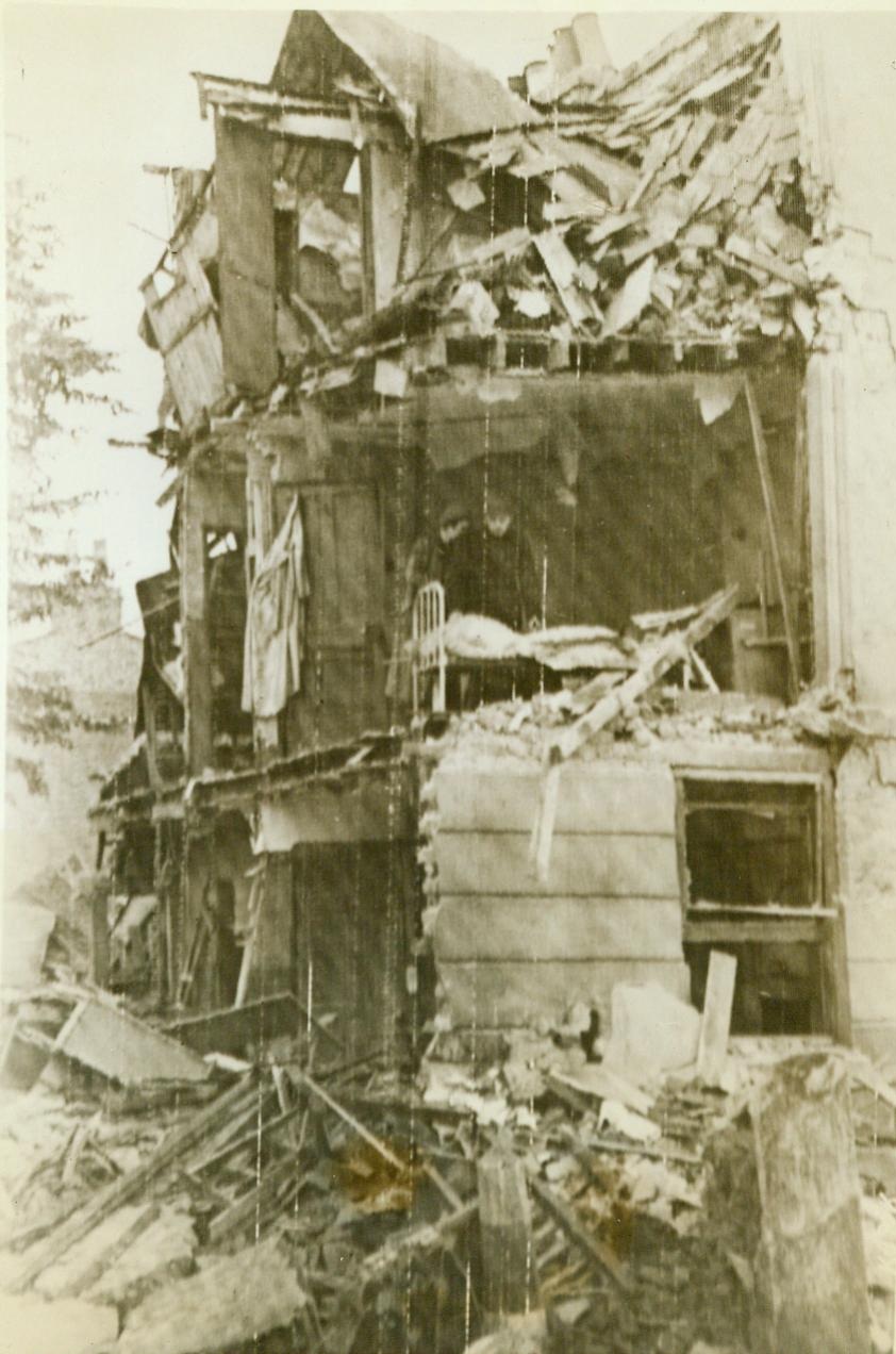 Nazi “robot planes” attack England, 6/17/1944. ENGLAND – Amid this shambles which was once a house in southern England, former residents search for their belongings which they left behind in their hurried evacuation of the area. Last night (June 16) the pilotless planes attacked England again, but on a smaller scale than the preceding raid. The aerial weapons are believed to be either rocket or jet-propelled. CREDIT (Signal Corps Radiotelephoto from ACMA) 6/17/44;