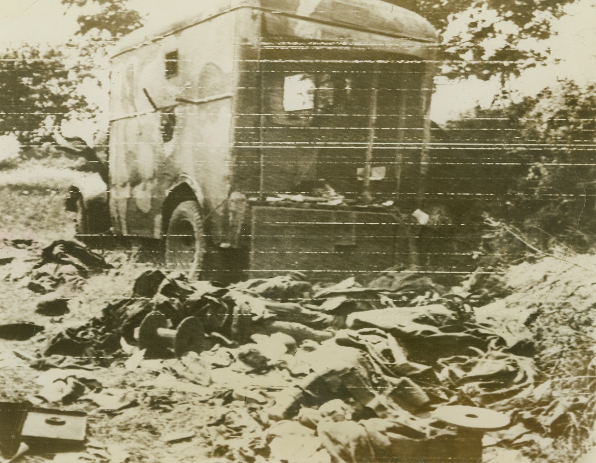Allied Bazooka Knocks Out Nazi H.Q. Car, 6/20/1944. France – The bodies of the nine occupants and official papers lay strewn over the road after a Bazooka shell hit this German headquarters car enroute across the Cherbourg Peninsula. The American forces are now within six miles of Cherbourg, and their heavy artillery fire is bombarding the city. Credit: ACME photo by Bert Brandt, War Pool Correspondent, via Signal Corps Radiotelephoto;