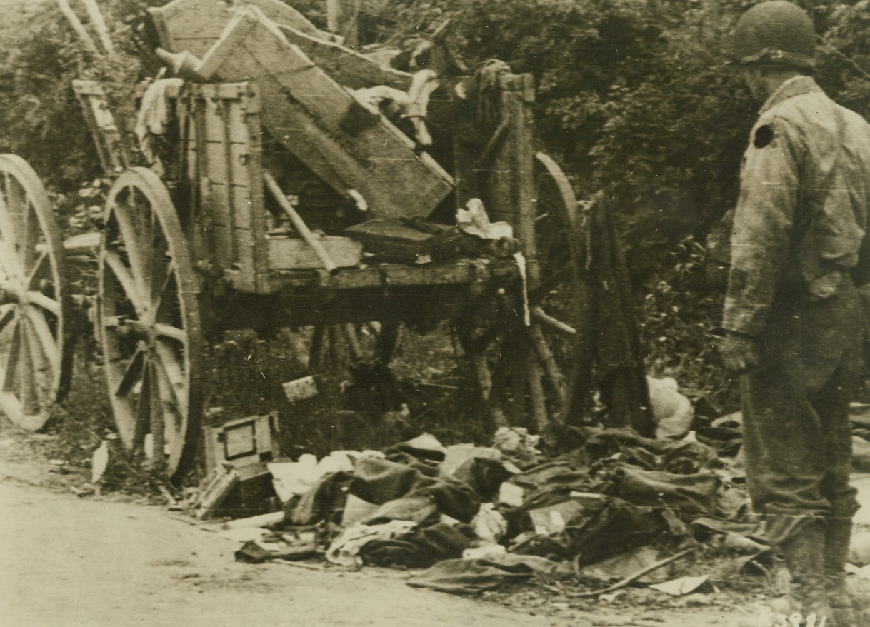 Supplies That Never Got There, 6/18/1944. France – Caught by an Allied fighter-bomber on the St. Mere Eglise-Montebourg road in Normandy, this wagonload of supplies never reached German lines on the Cherbourg peninsula. This is only a small example of how the Nazis, who are now using horse-drawn vehicles, are being thwarted in their attempts to get supplies to their troops. Credit: Signal Corps Radiotelephoto from ACME;
