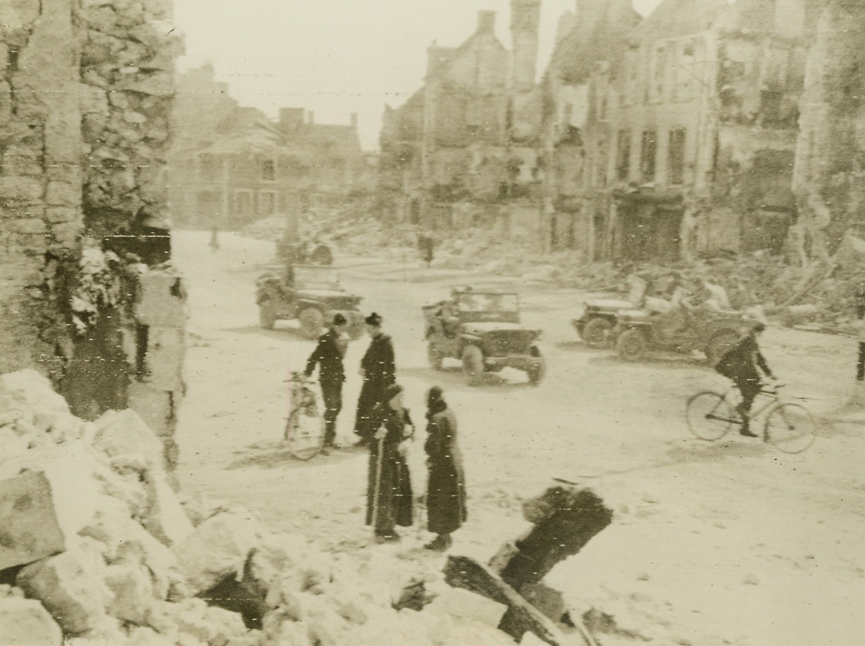 Home and Free, 6/19/1944. France – As the Allies push steadily inland, the peoples of the towns already occupied by British, American or Canadian troops start returning to their homes. This scene was taken in Insigny, France, as villagers returned to view their shell-shattered homes. Credit: Signal Corps Radiotelephoto from ACME;