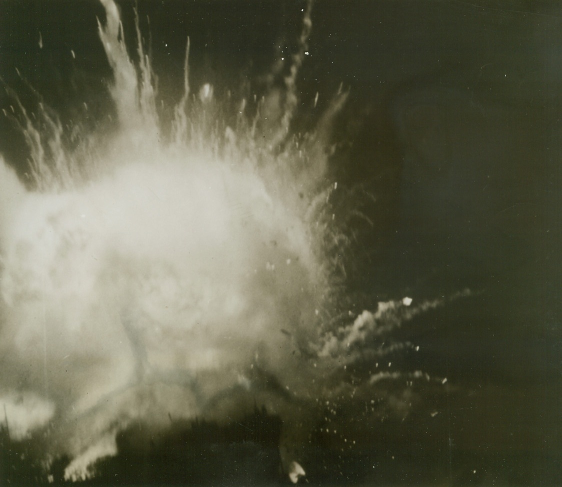 A Tanker Dies, 7/25/1944. AT SEA -- With a shattering roar, an Allied tanker explodes in a huge globe of flame, just before it went to the bottom following enemy action.  Credit Line (U.S. Navy Photo from ACME);