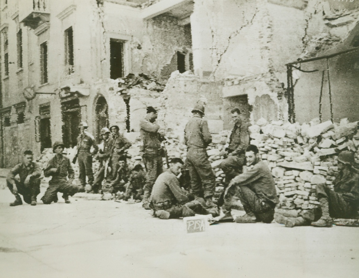 Chow Time for Yank Troops Near Pisa, 7/28/1944. ITALY – American troops find time for chow in the devastated outskirts of Pisa, being attacked by advancing forces of the Fifth Army. Opening stage in the battle for the historic Italian town has started with an artillery duel across the Arno River.Credit (Signal Corps Radiotelephoto from Acme);