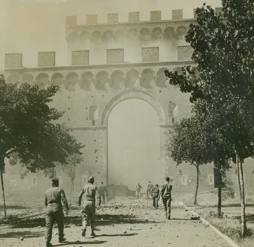 FRENCH CLEAR ROAD FOR ALLIED ADVANCE—#3, 7/9/1944. ITALY—French demolition workers race toward the blasted German road block they had just exploded in Siena, Italy. Road block halted Allied advance through the city hard on the heels of rapidly fleeing Nazis. Siena, only 25 miles from Florence, was recently captured by French troops of the Allied Fifth Army. Credit: Acme photo by Charles Seawood, War Pool Correspondent;