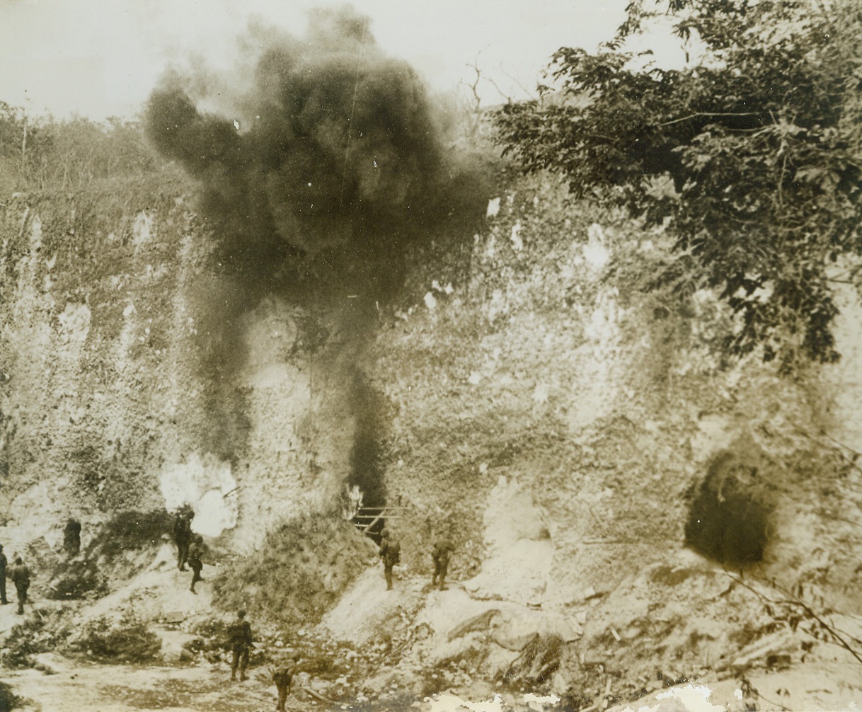 Burning Out Japs on Saipan, 7/13/1944. Marianas – American troops use flame throwers to roast the Japs out of cave hideaways in a quarry of Saipan, important base in the Marianas. U.S. forces have ended all organized Jap resistance on the island, and are using its excellent airfields for attacks on other Jap stongpoints. (Passed by Censors)Credit: ACME;