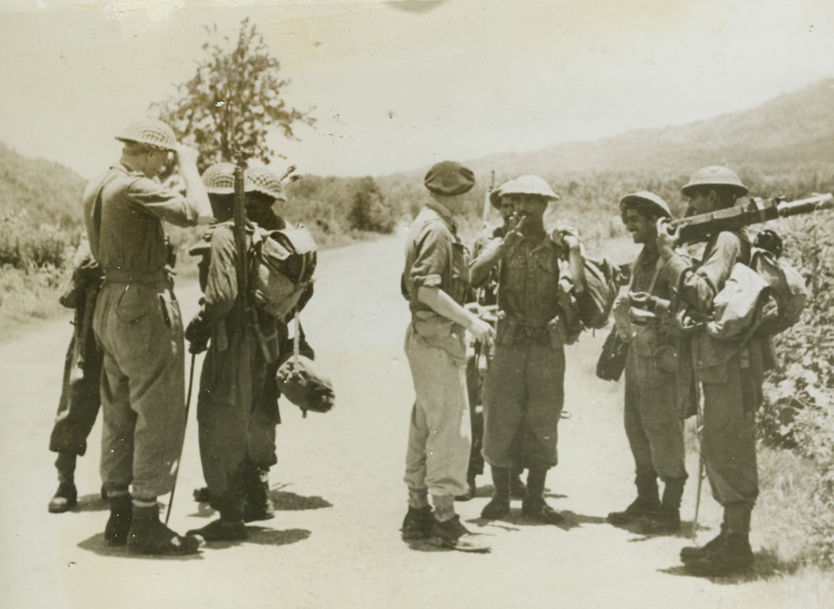 Troops Meet – Imphal-Kohima Road Opened, 7/14/1944. Burma – British Officers who had battered their way southward through Kohima greet Indian Troops from the south after the two groups of fighting men joined forces north of Imphal in a move that opened the whole of the Imphal-Kohima Road and eliminated further penetration by the Japs into India. Fighting under the worst possible monsoon conditions, and in the most bitter battles on the Burma front, remnants of Japanese Forces were cleared from the last part of the road.Credit: British Official photo from ACME;