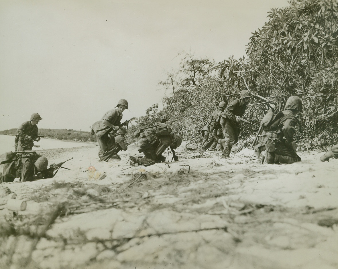 Sniper’s Bullet Fells a Marine, 7/21/1944. Saipan – Fighting Marines hit the ground as Japanese snipers open up on this small patrol on Saipan.  One Marine in foreground doubles up and pitches forward as a bullet hits him.Credit Line (U.S. Marine Corps photo from ACME);