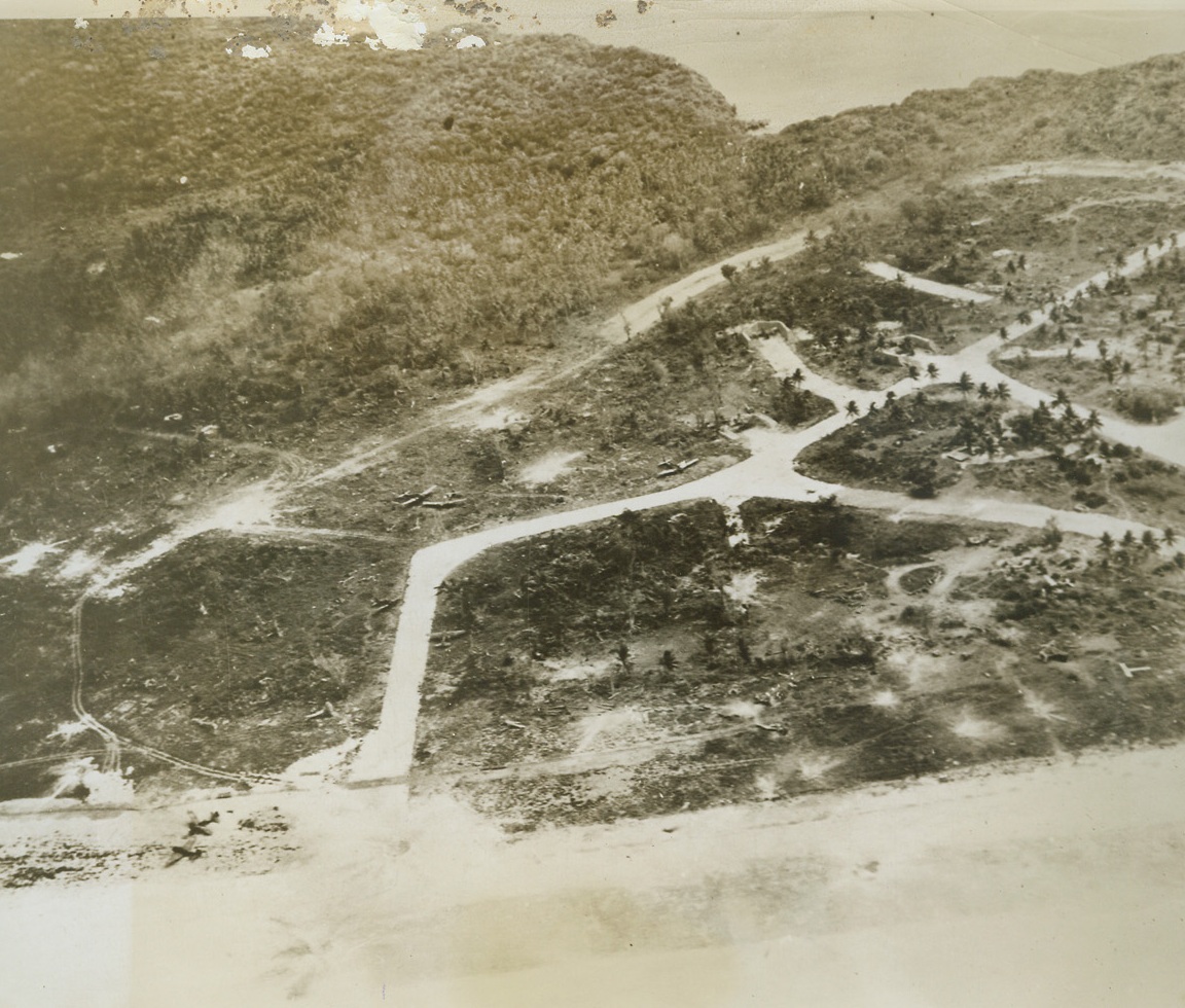 Guam Airfield Blasted, 7/26/1944. Guam – A Japanese airfield dispersal area on Guam received accurate bombing from carrier-based aircraft June 19th as is shown here by the wrecked Nipponese planes strewn on the beach, in revetments, and in open dispersal areas.  This is one of the airfields currently being assaulted by the combined American forces, and may now be in the hands of the invading Yanks. Credit Line (U.S. Navy photo from ACME);