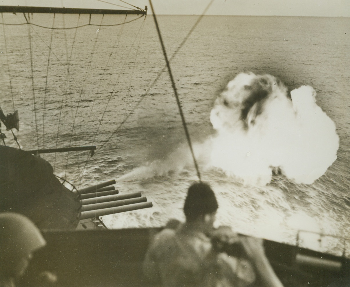 Fireball, 7/5/1944. Off Saipan – With a roar and a blast of vivid flame, a 14-inch gun aboard a U.S. battleship hurls screaming steel toward Jap positions on Saipan island.  This is only one of the hundred of guns of a giant Navy task force that helped U.S. Marines and Army troops establish their beachhead, last June 14.  Today, with the exception of a small pocket of resistance, American forces are in full possession of the strategic Mariana island. Credit line (U.S. Navy photo from ACME);