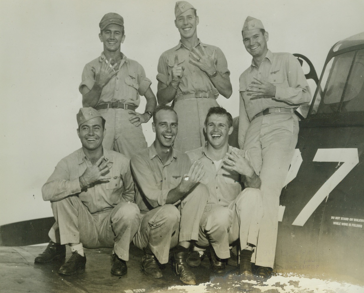 They Downed 28 Jap Planes, 7/6/1944. Pacific Fleet – Twenty-eight Jap planes were bagged by these members of famous “Ripper Squadron” in a singl run off Iwo Jima, June 24.  Top row, left to right: Lt. (JG) Barney Barnard, Donna, Tex., who bagged 5; Ens. W.B. Webb, Wichita Falls, Tex., 6; Comdr. William A. Dean, Coronado, Calif., 4.  Bottom row, left to right: Lt (JG) Merriwell W. Vineyard, Whitewright, Tex., 4; Lt. (JG) E.C. Gargreaves, Brimfield, Tex., 4; and Lt. Russell L. Reisener, Redwood City, Calif., 5.  The squadron has shot down 120 planes in combat, destroyed more than 120 on ground. Credit line (ACME);