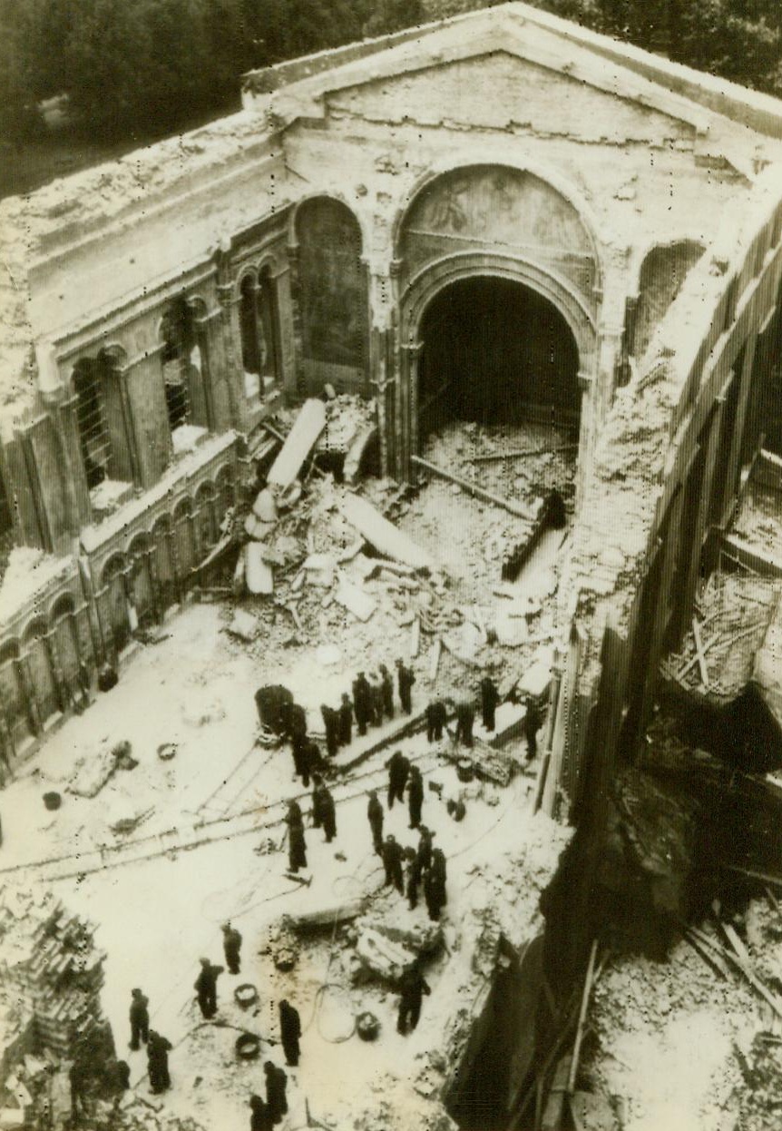 Guards chapel hit by robot bombs, 7/9/1944. LONDON - Many casualties resulted when the famous guards chapel of Wellingon barracks was badly damaged by Hitler's robot bombs. Wreckage of the place of worship is shown in this overhead view, as salvage workers begin to clear the debris. Endling the longest lull since the launching of Germany's "Ersatz Blitz", the blind bombs again thumped down over southern England last night. CREDIT LINE (ACME Radiophoto) 7/9/44;