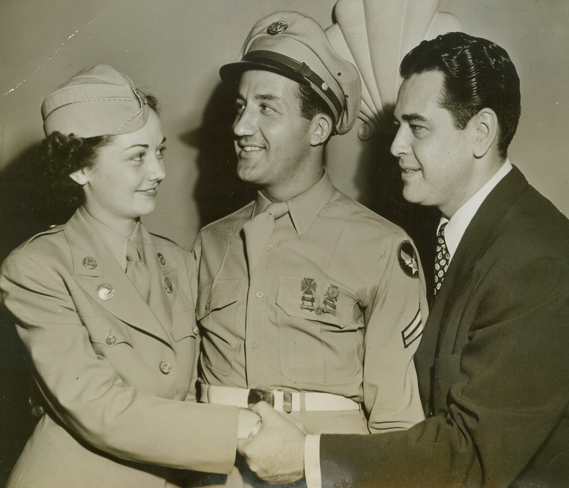 ATC’S COVER GIRL, 7/15/1944. NEW YORK—Pvt. Lucille Berman (left), of the Ferrying Division, Love Field, Dallas, Tex., has been acclaimed Typical WAC by the Air Transport Command. The contest was judged solely by Harry Conover (right) who chose the winner from letters written by various soldiers describing the virtues of their candidate. Cpl. Bernie Berman, Jacksonville, Fla., who wrote the winning letter, married Pvt. Berman three days after she was announced the winner. Pvt. Berman was given official tribute at the Conover Model Agency today (July 15). Credit (ACME);