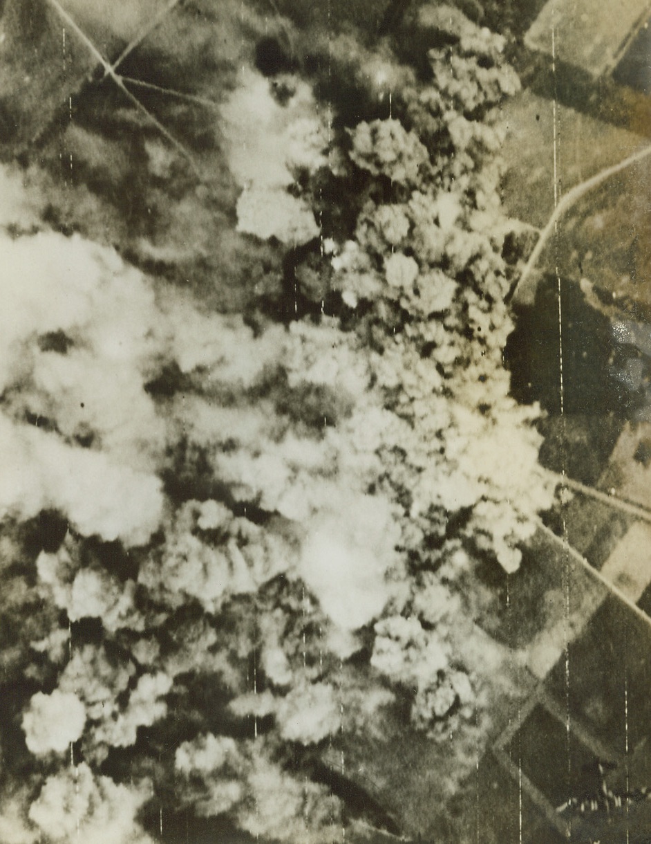 Concentrated Destruction, 7/19/1944. France – Royal Air Force Lancasters left this smoke-smothered target after bombing Nazi gun concentrations at Cagny, southeast of Caen. More than 1,000 planes dropped fourteen thousand tons of bombs during the attack on the German Army in the field. Credit: British Air Ministry photo via Signal Corps Radiotelephoto from ACME;