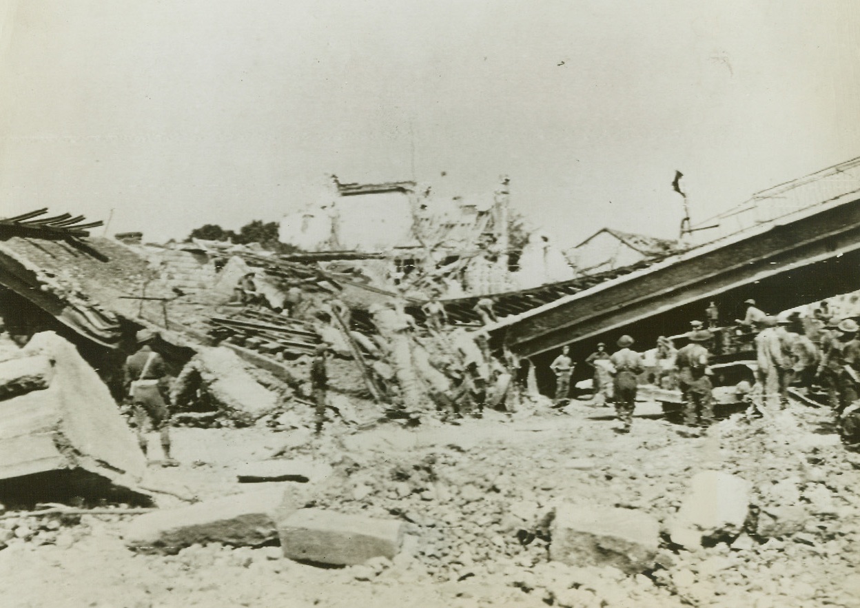 Reconstruction Under Way, 7/22/1944. Vaucelles, France – Destroyed by Allied precision bombing, this bridge proved a blockade for German supply lines and troop movements during the invasion of the Cherbourg Peninsula. Canadian engineers start to rebuild the railway bridge so that it may aid the Allies. Credit: Canadian official photo via US Army Radiotelephoto from ACME;